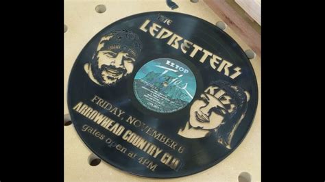cnc records|Making some CNC album art with a blue laser and a vinyl record.